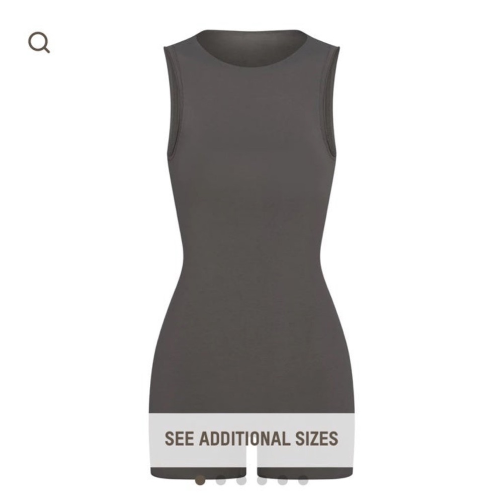 Authentic nwt skims raw edge onesie.  Size M.  Color Gunmetal